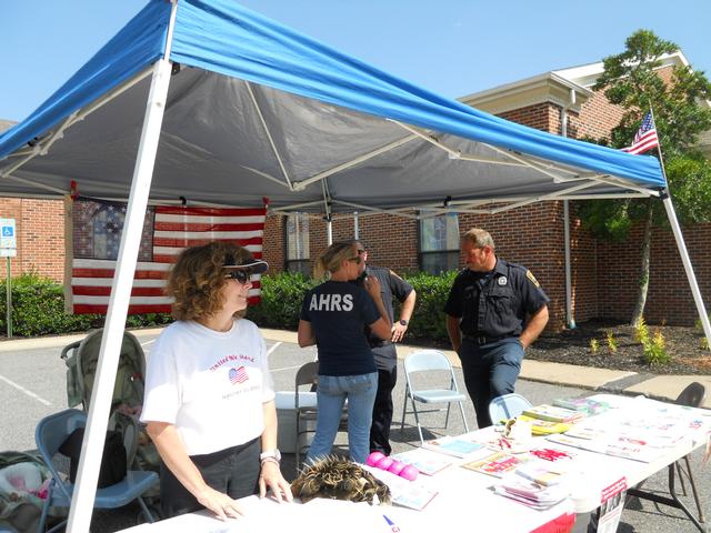 Sharon awaits the next visitor to the information table at the fall festival
2011